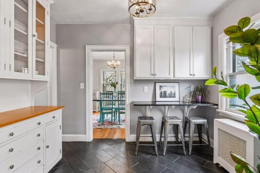 Open flow kitchen connecting seamlessly to additional prep and seating space