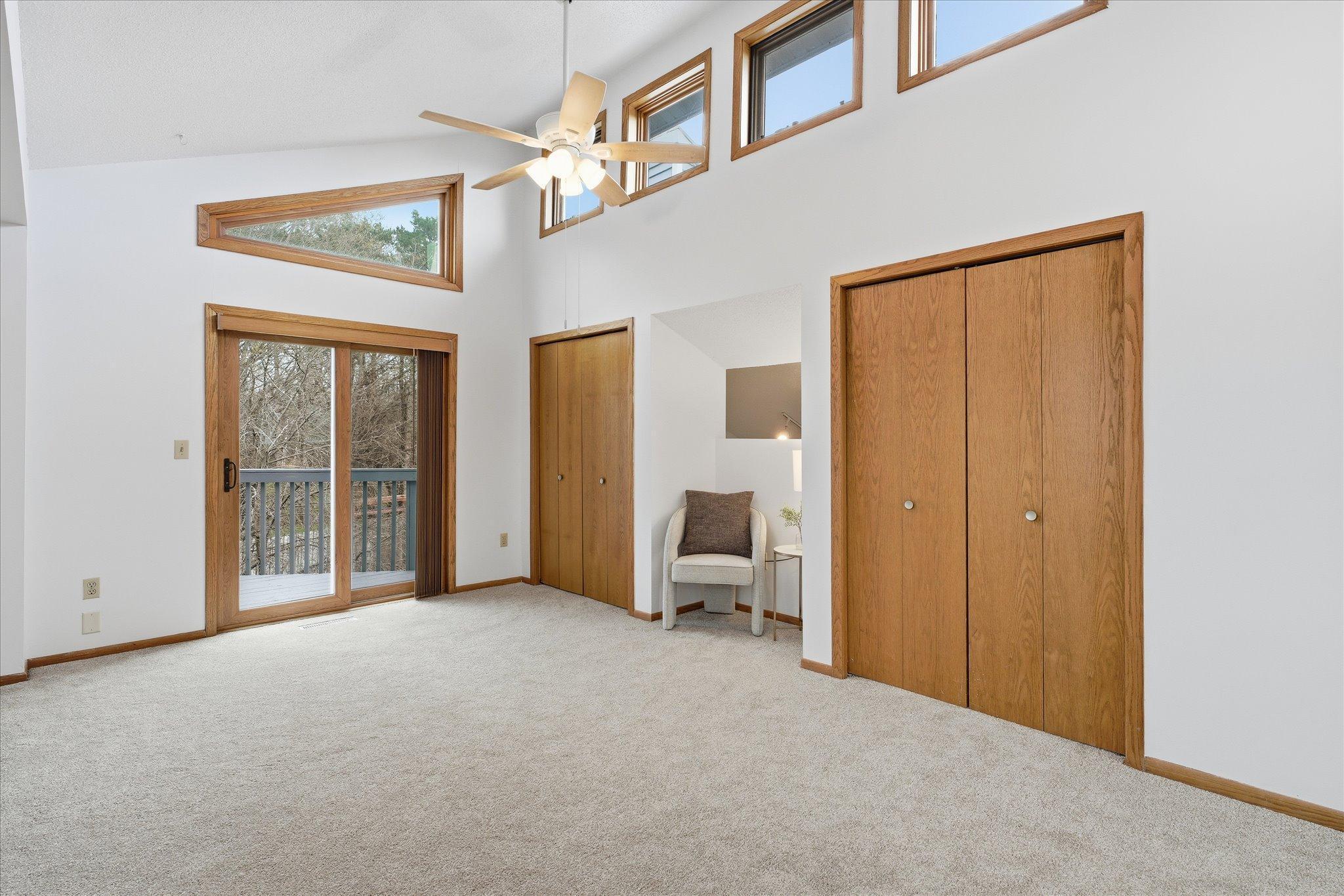 Large Primary Suite features great natural light and a balcony!