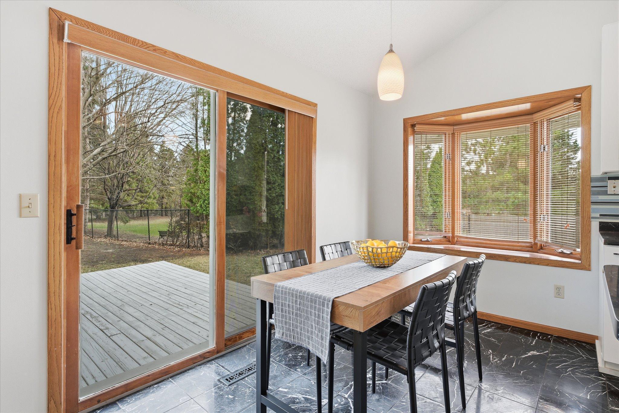 Dining area opens out to large deck and yard!