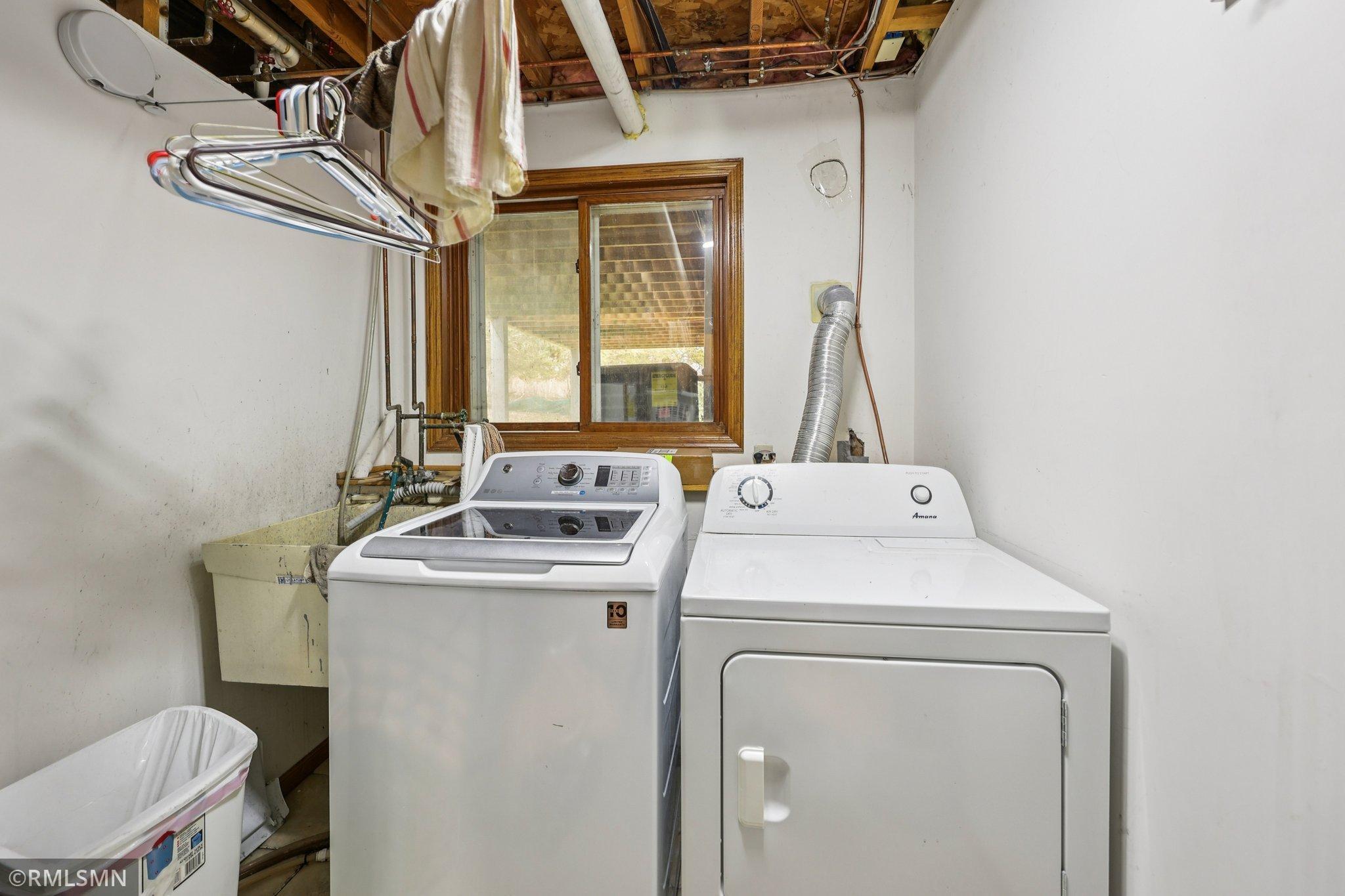 Laundry is in the furnace room and has a window under the deck