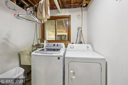 Laundry is in the furnace room and has a window under the deck