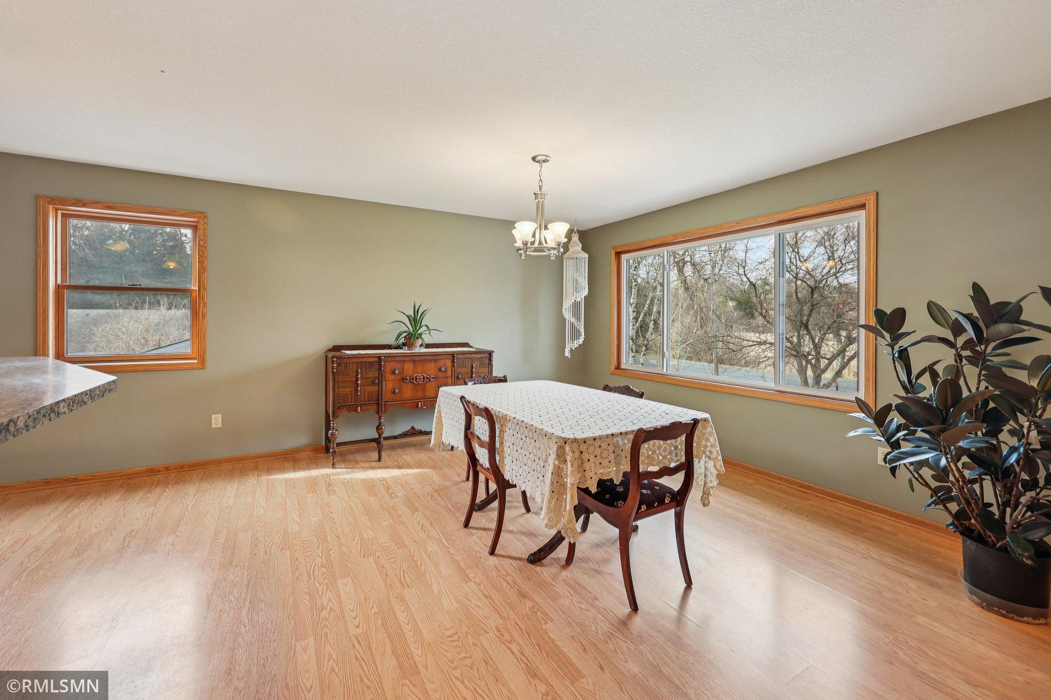 Beautiful light-filled dining room, plenty of space for a huge table-You enjoy views of the pond from this room