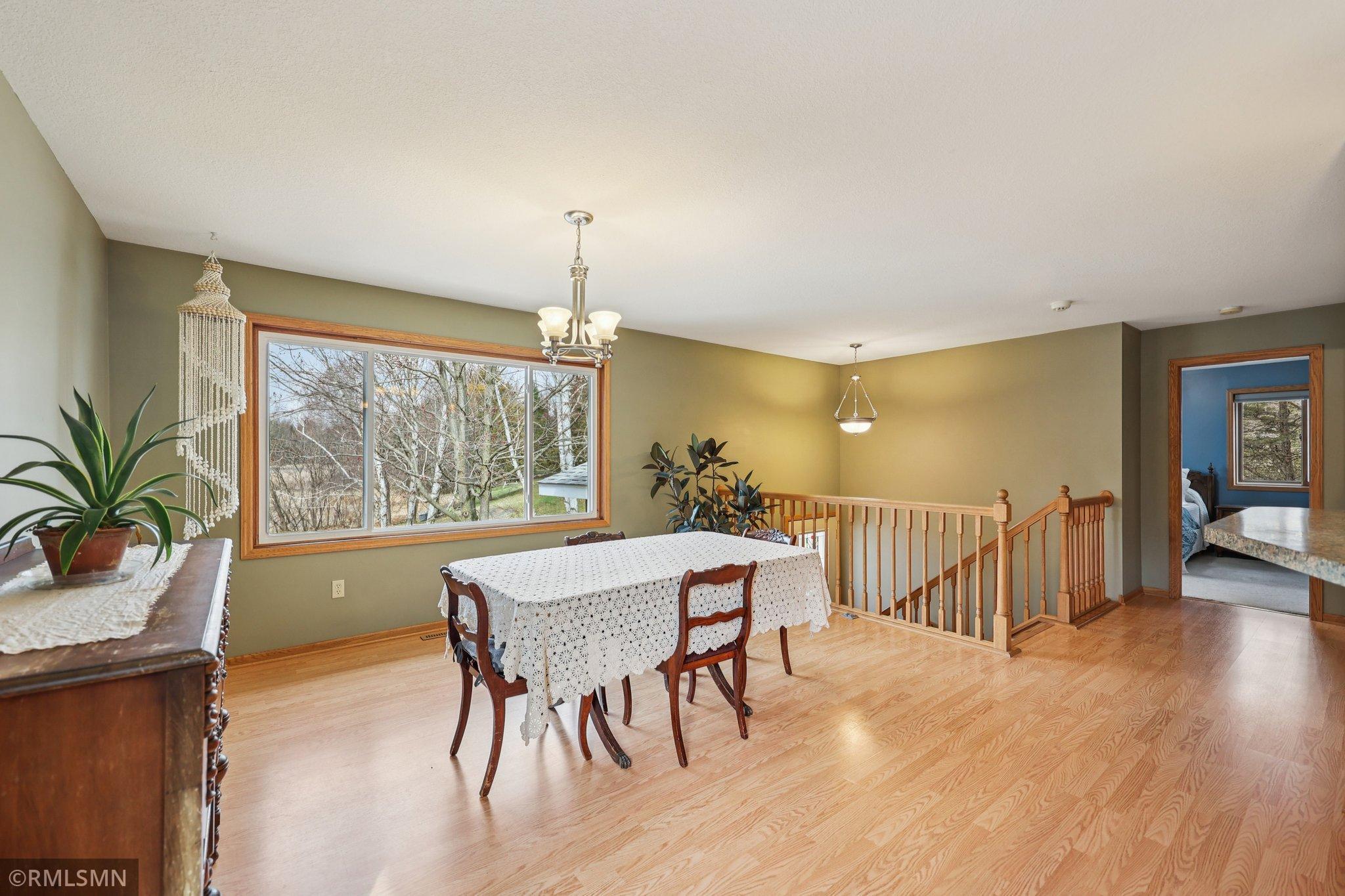 The upper-level bedroom is to the left at the top of the stairs