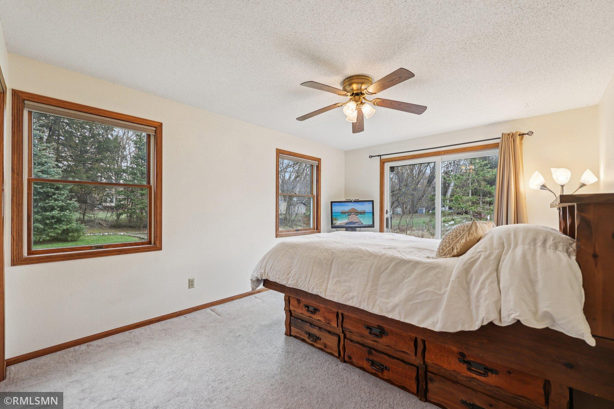 Bedroom 5 is also another walkout room with lovely views of the backyard