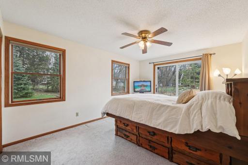 Bedroom 5 is also another walkout room with lovely views of the backyard