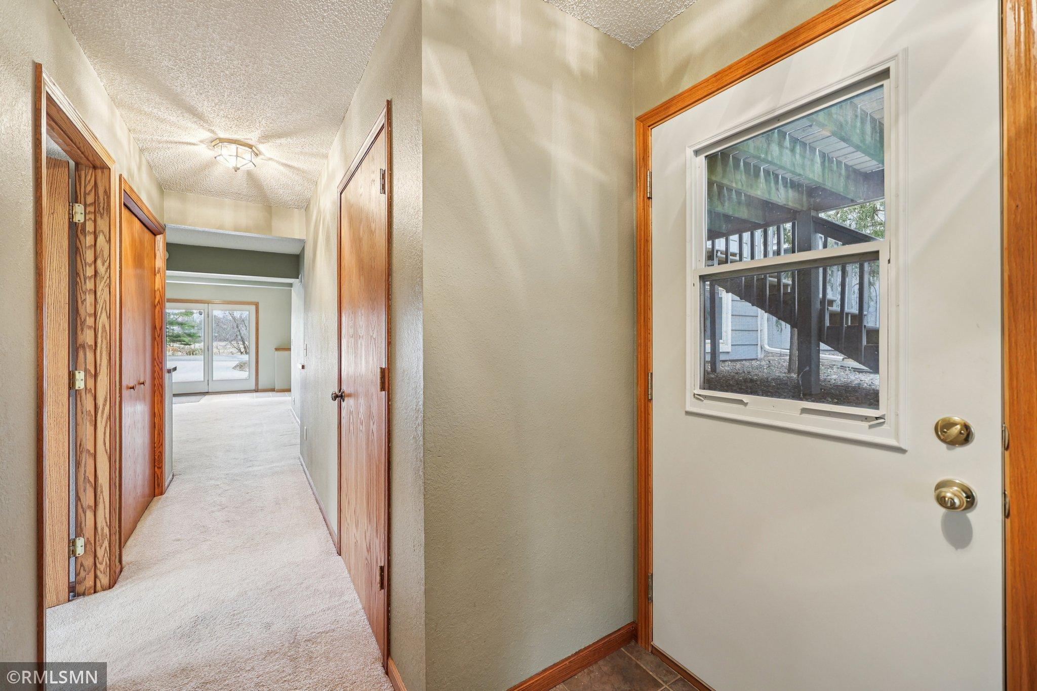 Large hall closet, first open door on the left is bedroom 4-additional closet on the right-door goes out under the deck