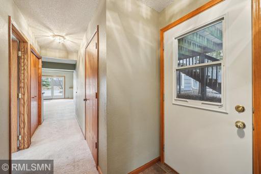 Large hall closet, first open door on the left is bedroom 4-additional closet on the right-door goes out under the deck