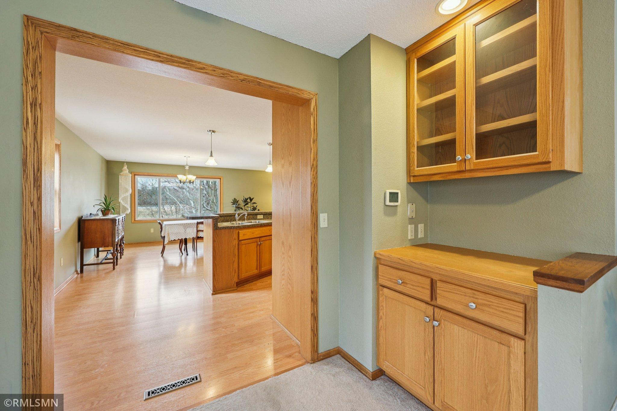 The serving counter and storage cabinet are right inside the great room