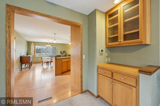 The serving counter and storage cabinet are right inside the great room