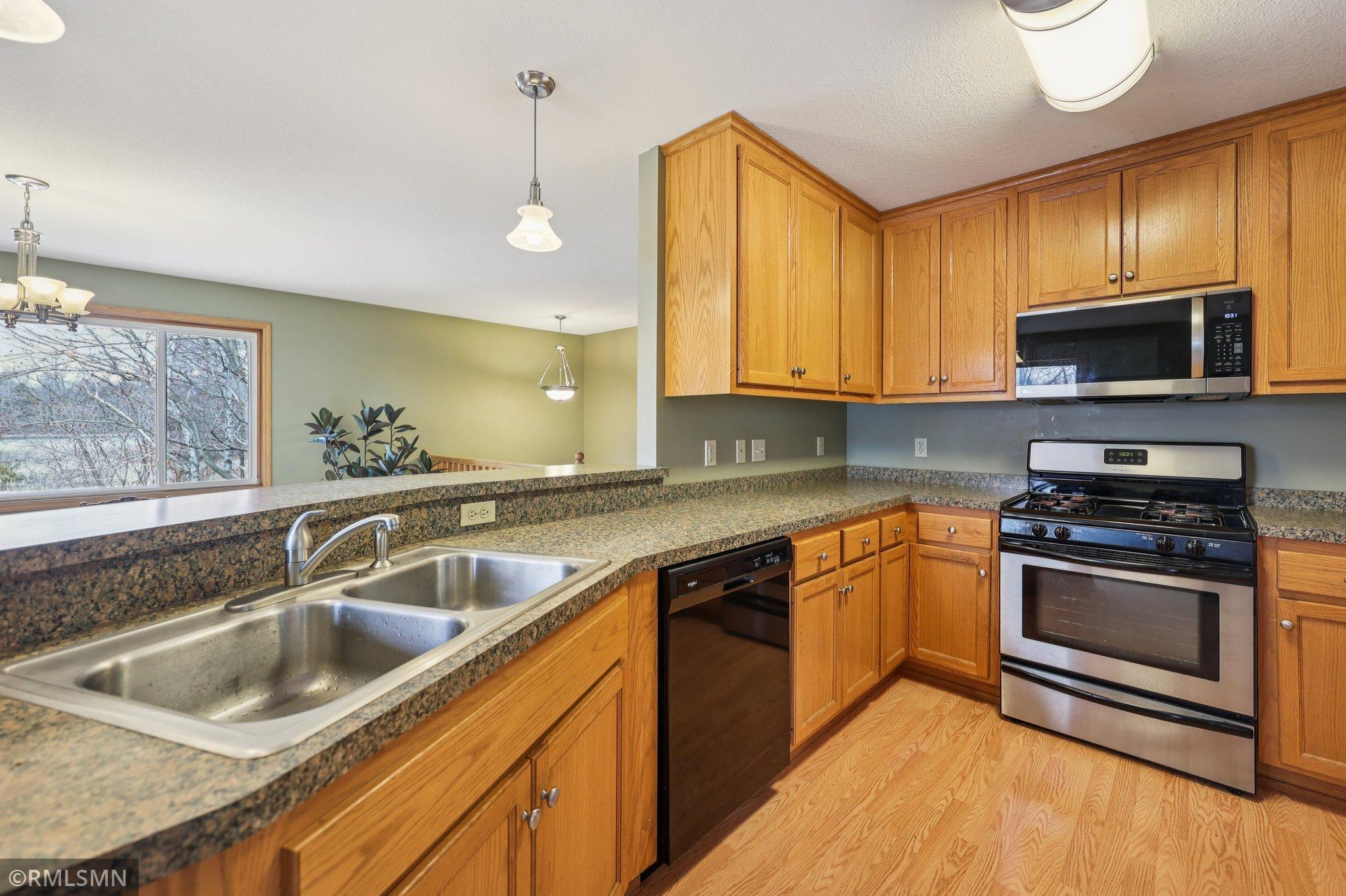You have a lot of workspace in this well-laid-out kitchen. Don't let the pond views distract you from making dinner!