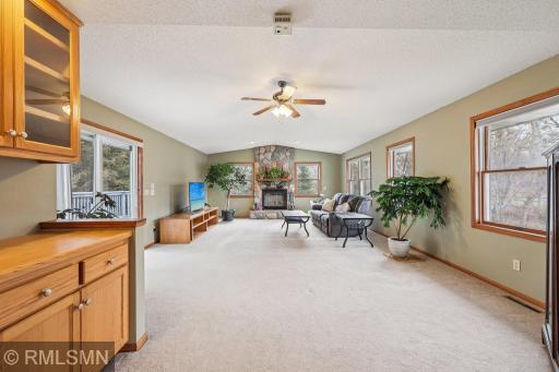 Giant great room with deck access and a wood-burning fireplace, just serviced and ready for use!