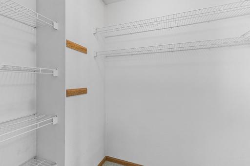 The primary walk-in closet. Room for all your clothes!