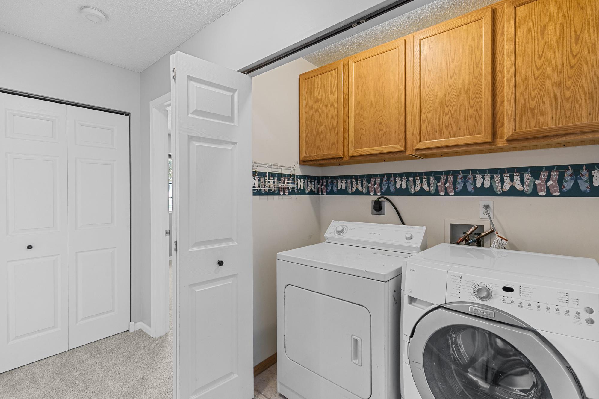 The laundry is located just down the hall from the bedrooms.