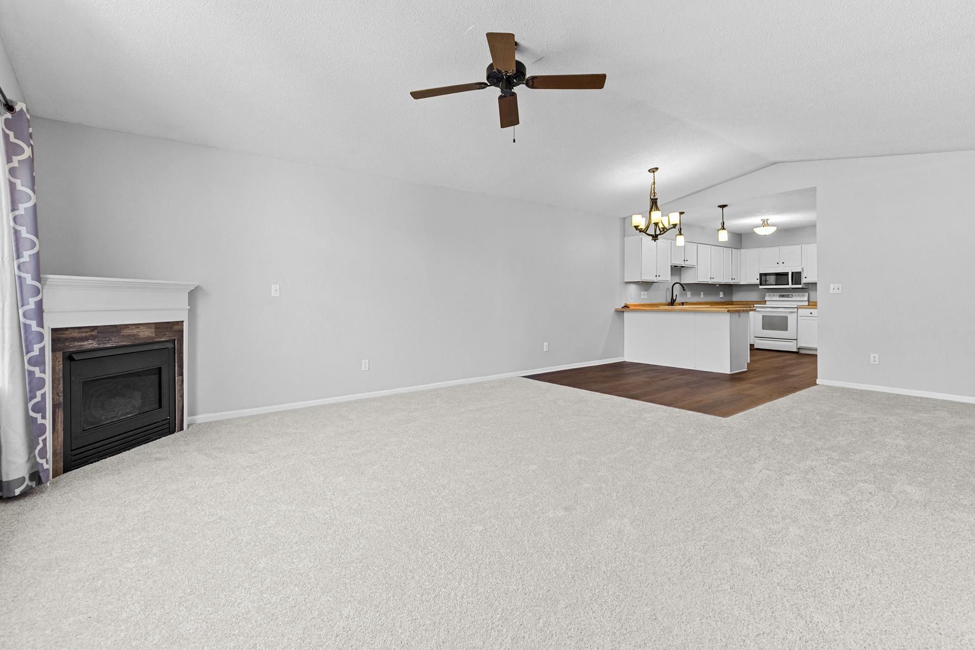 Living/ Dining/Kitchen- gas fireplace. New flooring and paint. Ready to move in!
