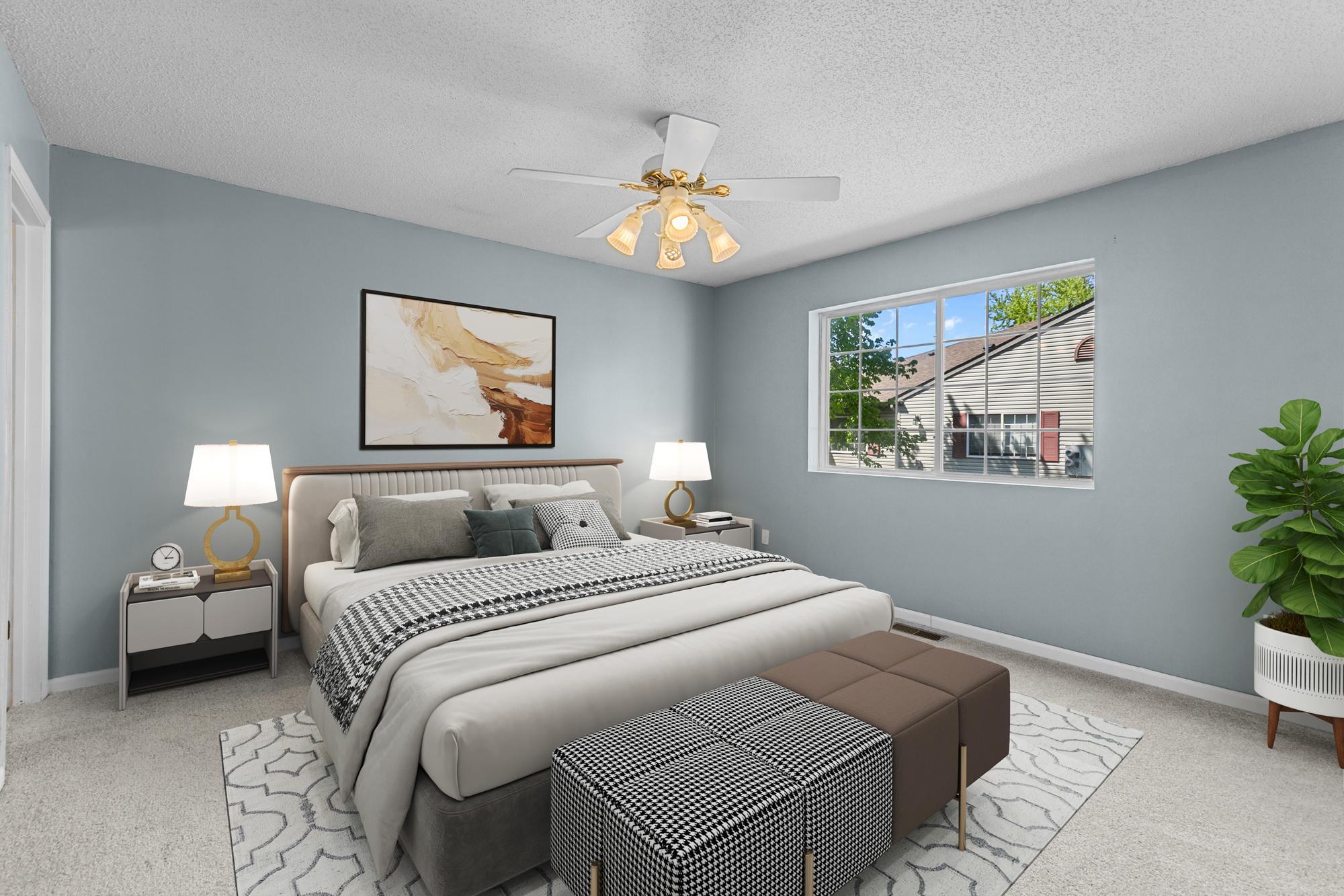 Virtually staged primary bedroom with a 3/4 bath.