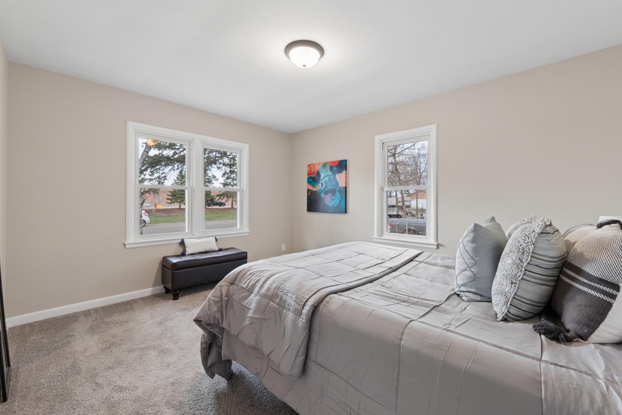 Dining area with large windows overlooking the backyard, offering great natural light and an open feel.