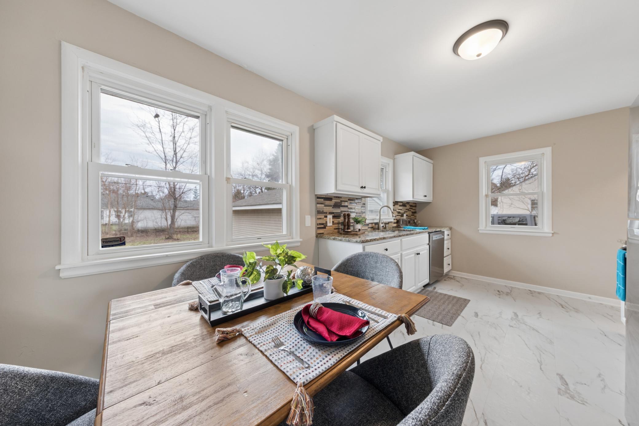 Kitchen with stainless steel appliances, abundant cabinetry, and durable flooring, perfect for everyday living.