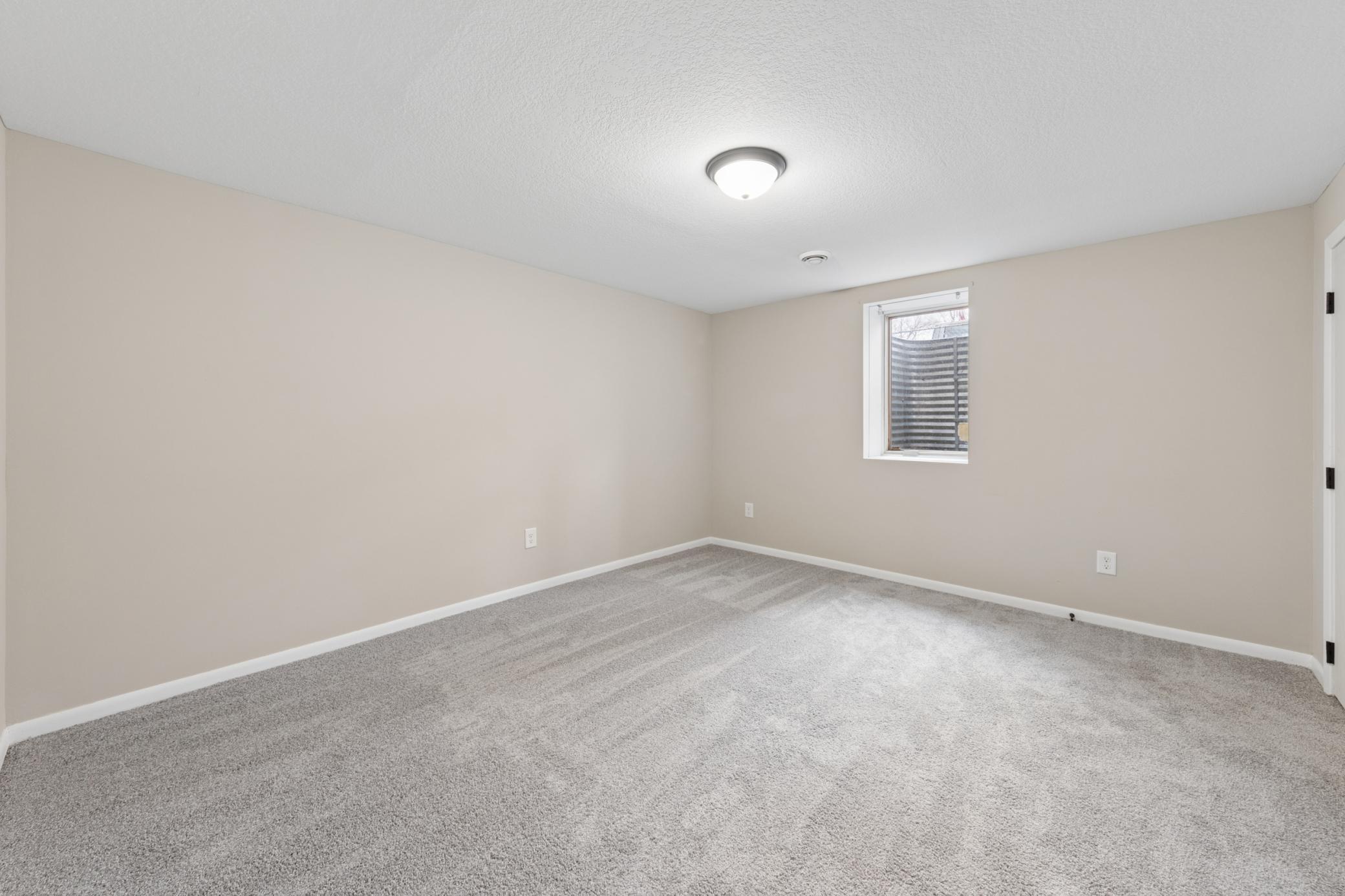 Large finished lower level with updated flooring and plenty of room for entertaining or relaxing.