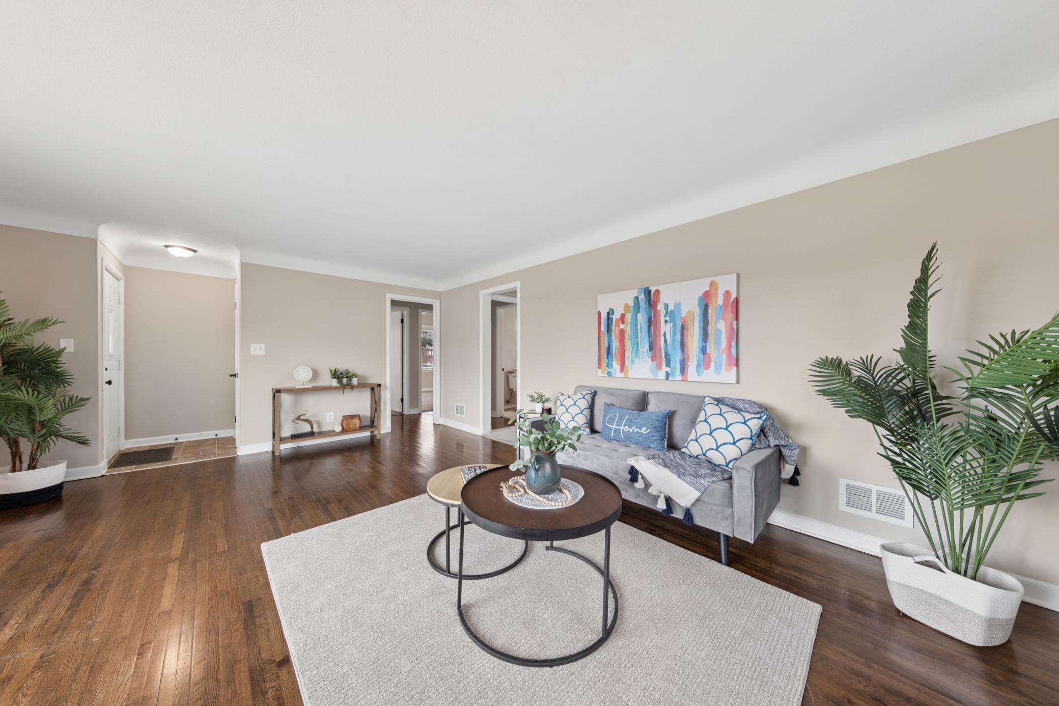 Tastefully staged living room with modern finishes, neutral tones, and an abundance of natural light.