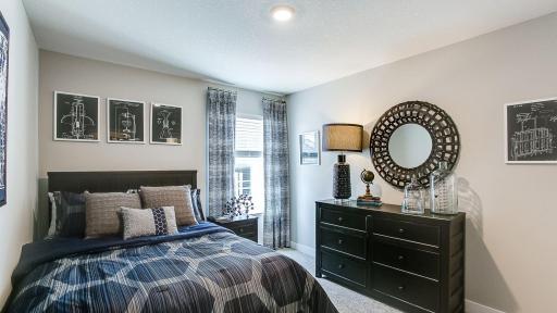 Spacious bedroom #2. Photo is of model home. Colors and options may vary. Ask Sales Agent for details.