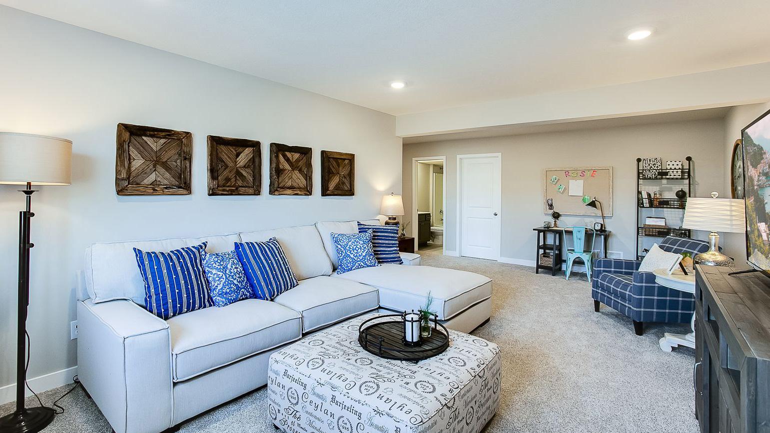 Included finished lower level with family room, bedroom and full bath. Photo of Model Home. Options and colors may vary. Ask Sales Agent for details.