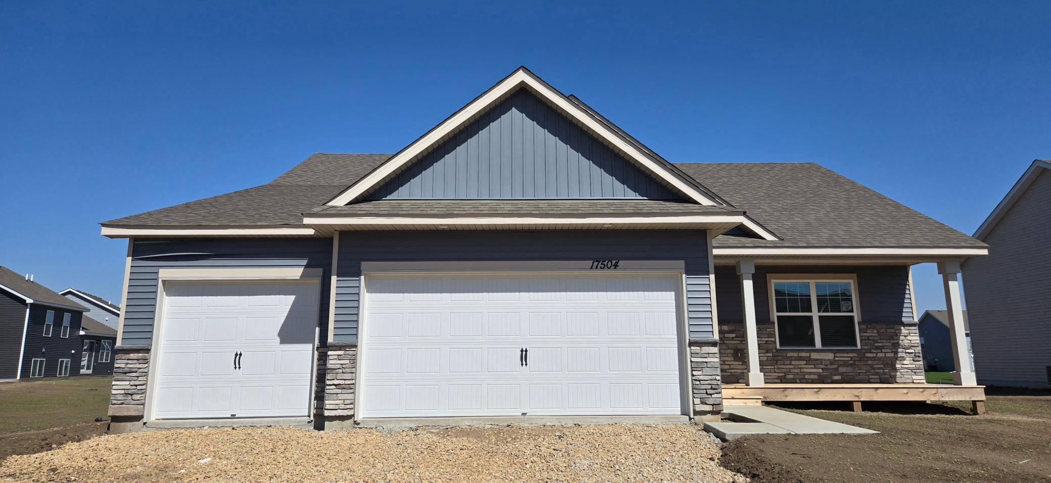 The Finnegan Heartland Cottage shown with optional stone at Highlands at Eagle View in Elko New Market. Photo is of a similar home. Options and colors may vary. Ask Sales Agent for details.