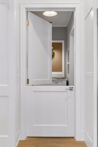 Charming Dutch door that adds character separating the kitchen from the mudroom area