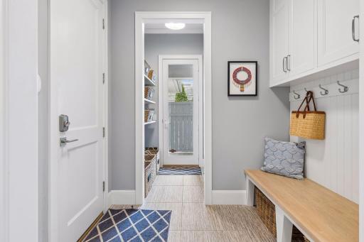 Entry from the garage with built-in bench and extra closet space