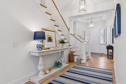 Two story ceiling and hardwood flooring throughout
