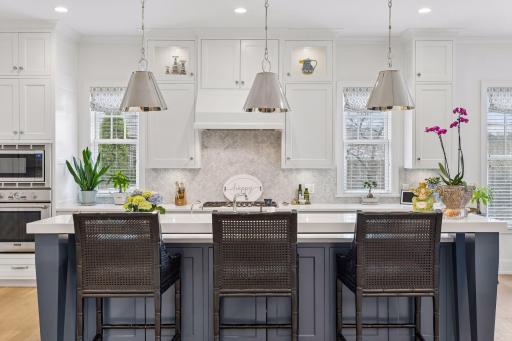 Kitchen windows allow natural light to flood into this space