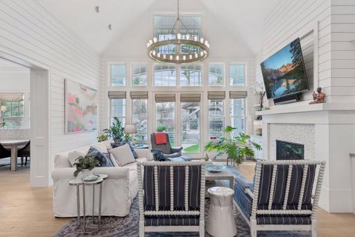 Stunning open-concept Great Room with abundant natural light, custom built-ins, and serene backyard views.
