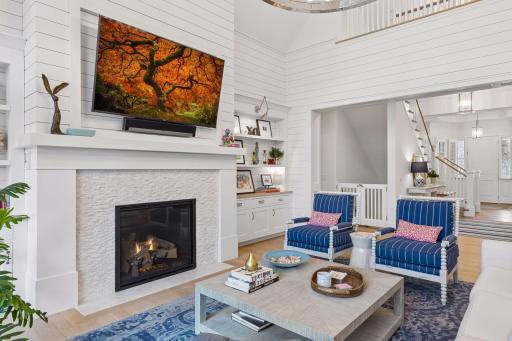 Inviting Great Room featuring a cozy gas fireplace and elegant shiplap detailing throughout