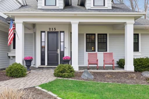 Lovely front porch seating area to greet your guests or enjoy a morning cup of coffee