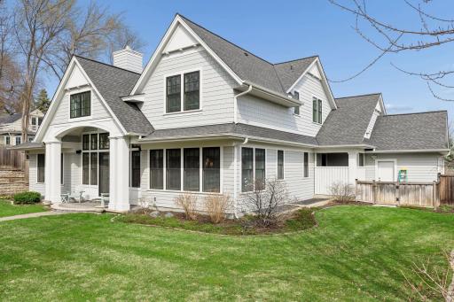 South side of the house has a fenced in area with a dog door into the mudroom and extra space for gardening essentials.