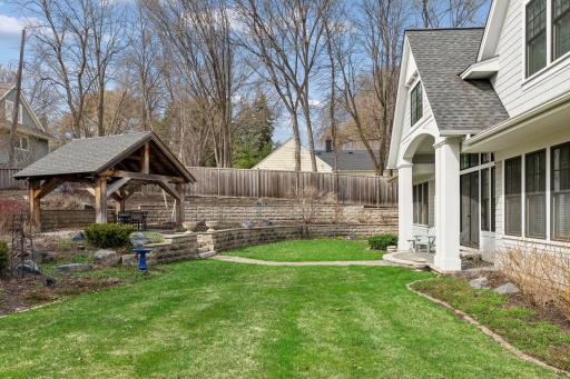 The backyard is completely enclosed with a privacy fence