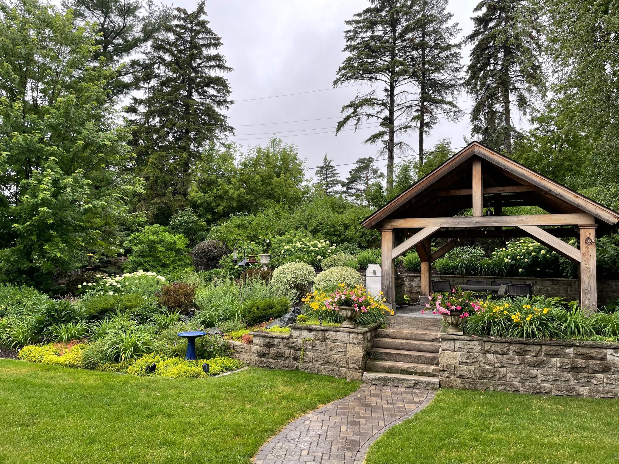 Beautifully landscaped yard and sitting gazebo
