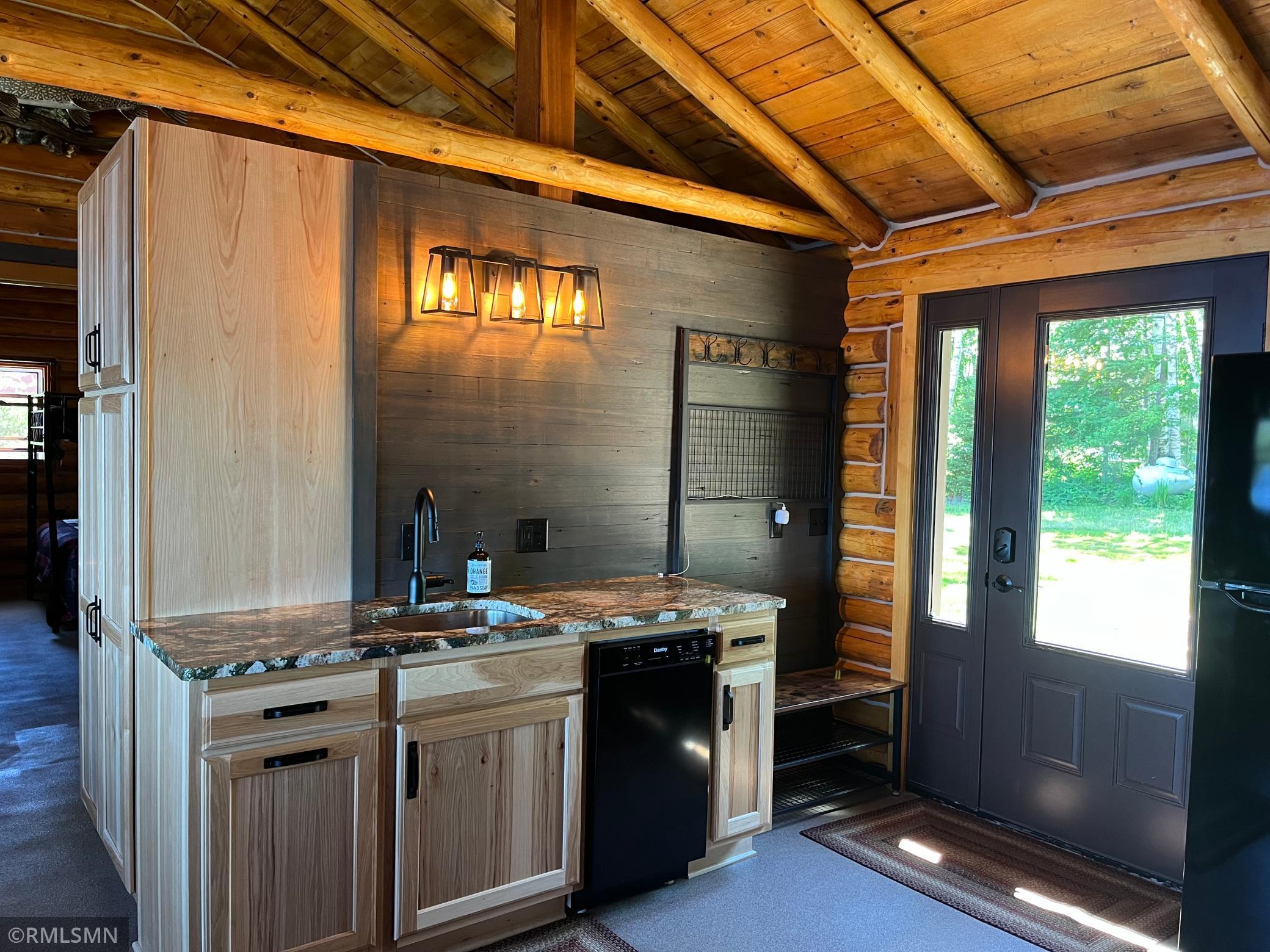 Kitchen sink, dishwasher and extra storage with pantry