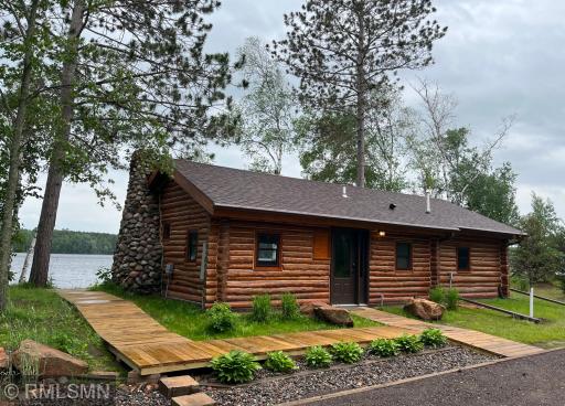 Wrap around boardwalk from front entry to lakeside deck and dock areas