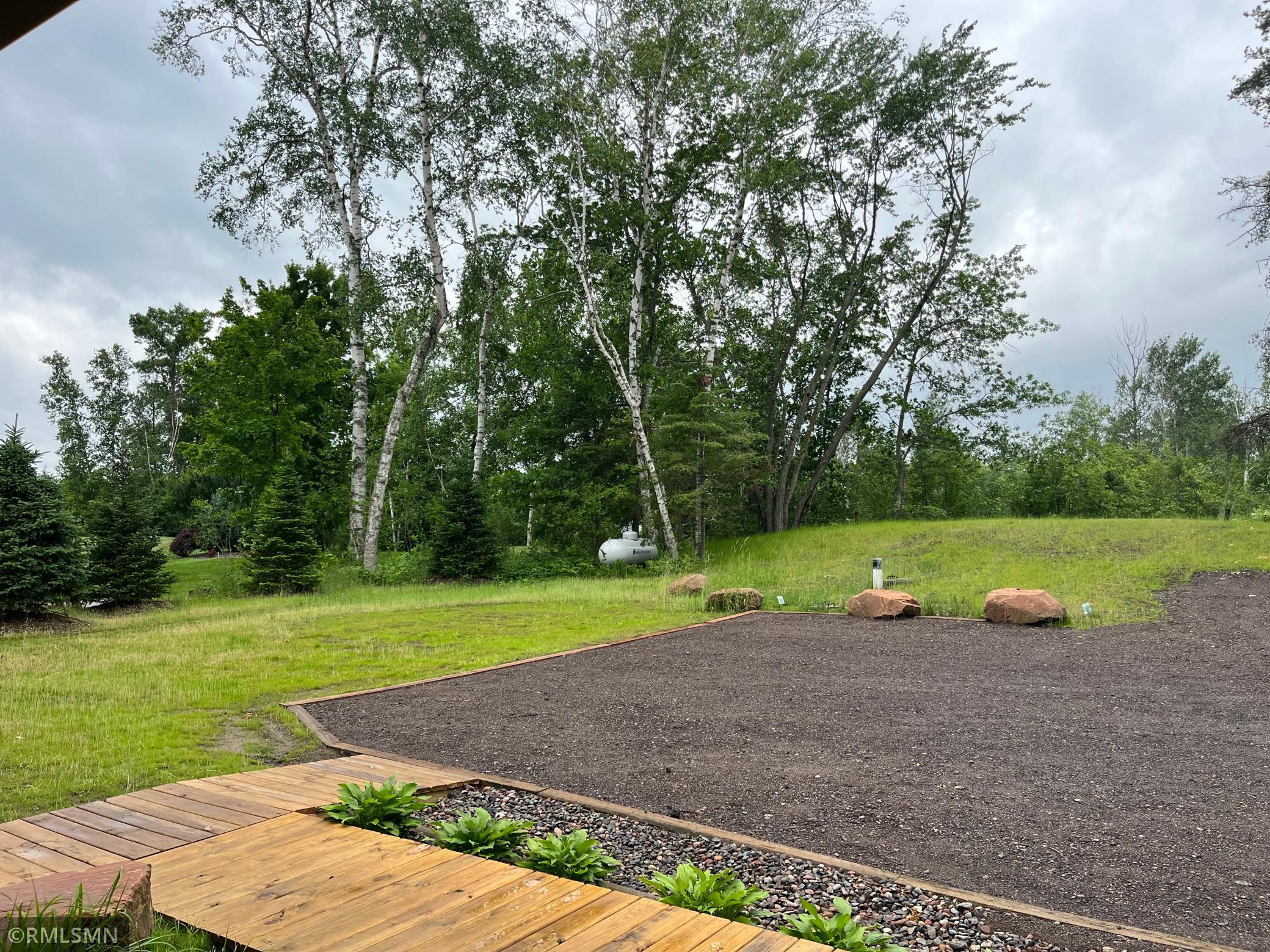 Driveway and parking area features crushed asphalt