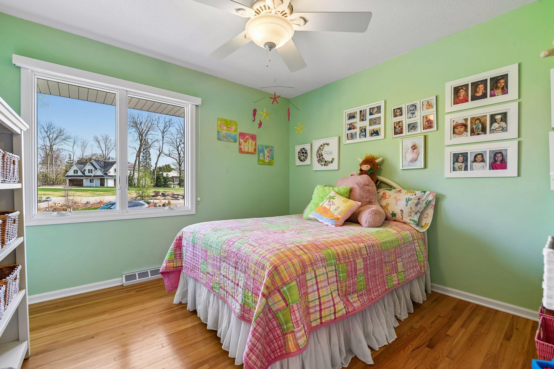 Third bedroom with oak hardwood floor