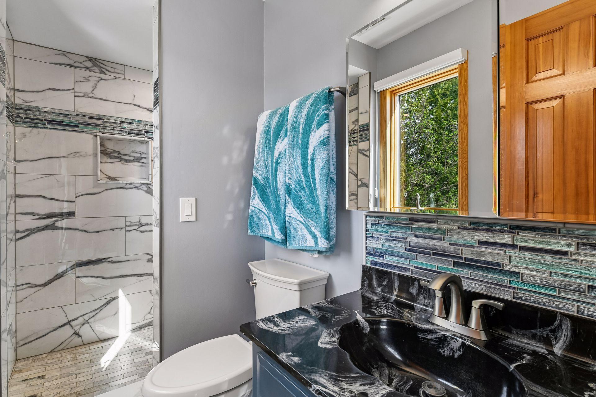 - Lower level bathroom with extra large shower