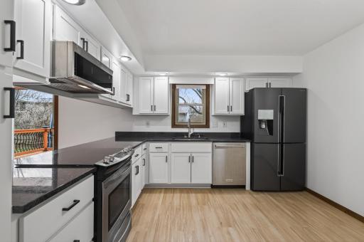 Brand new kitchen with cabinets, granite countertops and SS appliances.