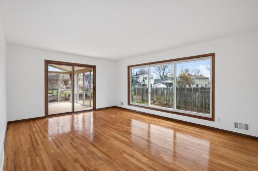 Large living room with oversized windows and abundant natural light.