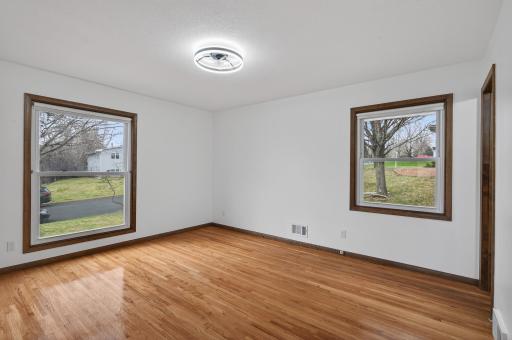 Primary bedroom with double closets, windows on two walls and 3/4 bath.