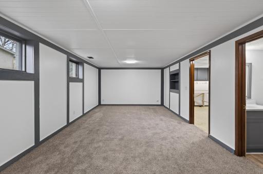 Lower level family room with brand new carpet.