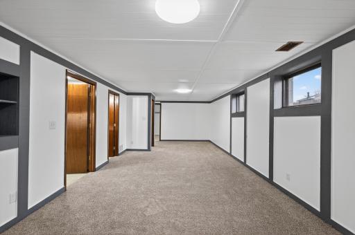 Lower level family room with brand new carpet.