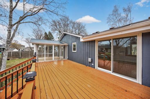Large deck with access to the 3 season porch on one side and dining room on the other.