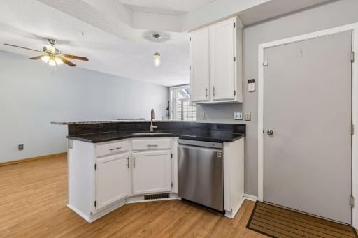 The dark counter tops really make this kitchen pop! 2200 Ranchview Lane North - Spacecrafting - 0015.jpg