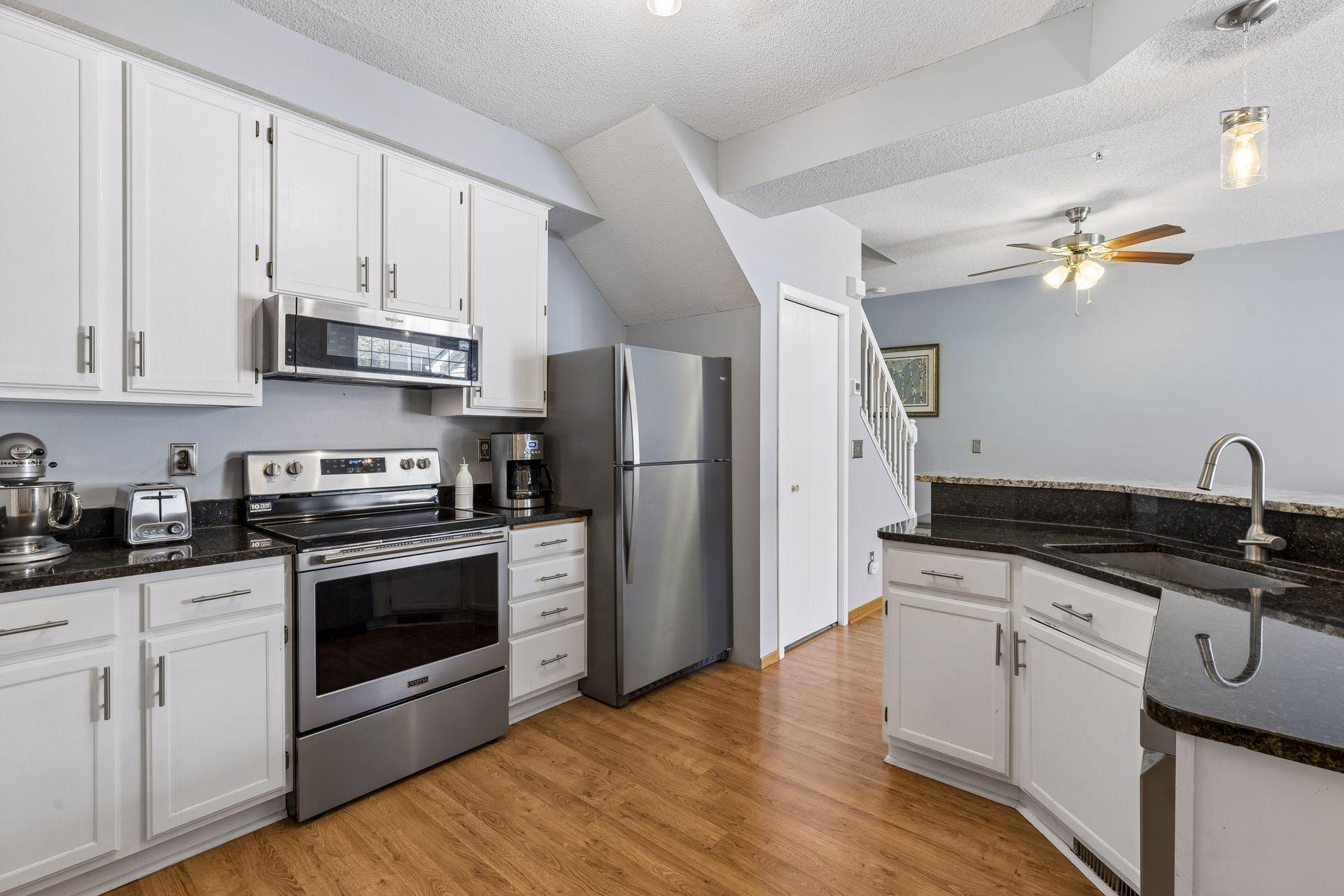 The seller added stainless steel appliances which look great in this kitchen!ing - 0016.jpg