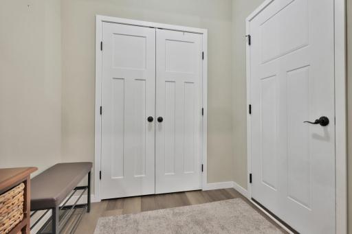 Mudroom with closet and garage entrance